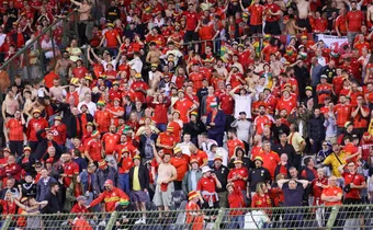 Football fan rushed to hospital after falling from upper stands during wild celebrations