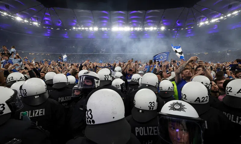 Wild stadium invasion and police clash leaves 25 fans seriously injured