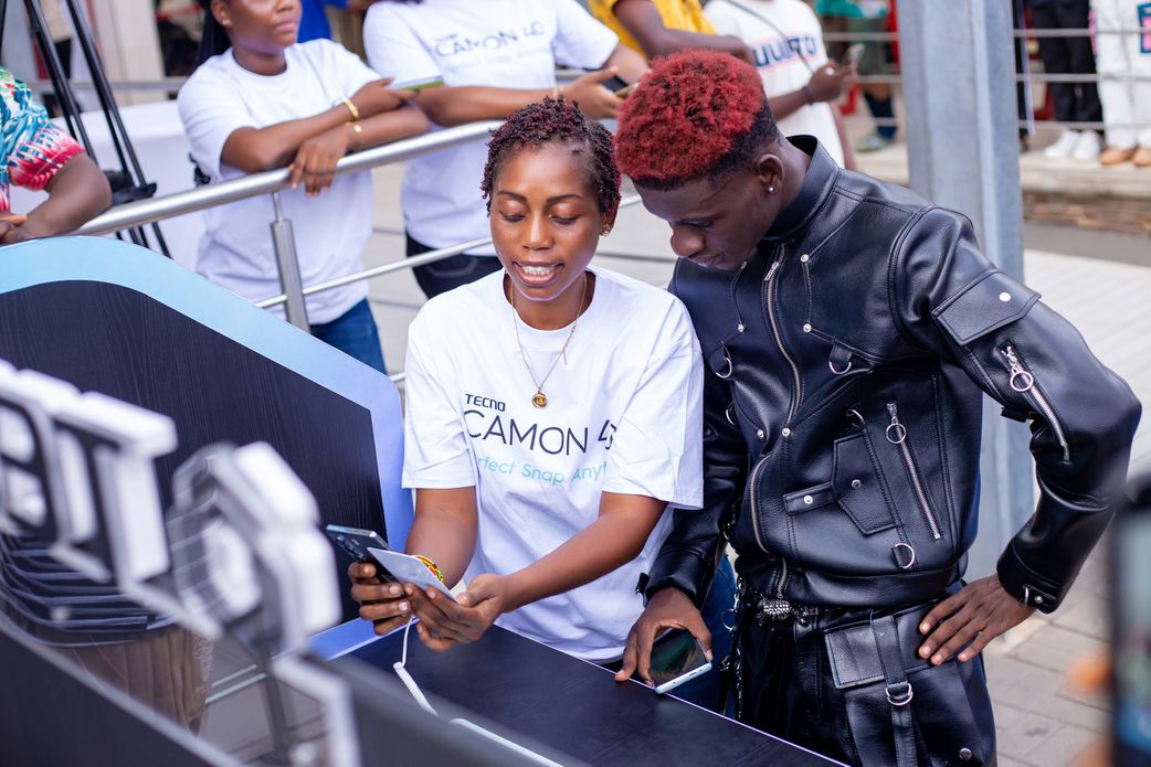 1Allo Danny observes a live demo using the Tecno CAMON 40