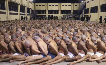 Inmates are lined up during a security operation at the Izalco prison in San Salvador, El Salvador, on April 25, 2020. El Salvador Presidency Press Office / AP