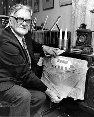 Kjell Stensson shows how to place a nylon stocking over a TV screen. He posed for this photo decades after 1962. [The Musuem of Hoaxes]