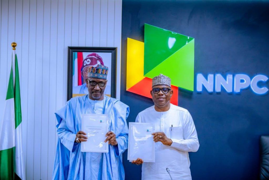 The new Group Chief Executive Officer of the Nigerian National Petroleum Company Limited (NNPC Ltd.), Bayo Ojulari (right) officially takes over from his predecessor, Mr Mele Kyari (left).