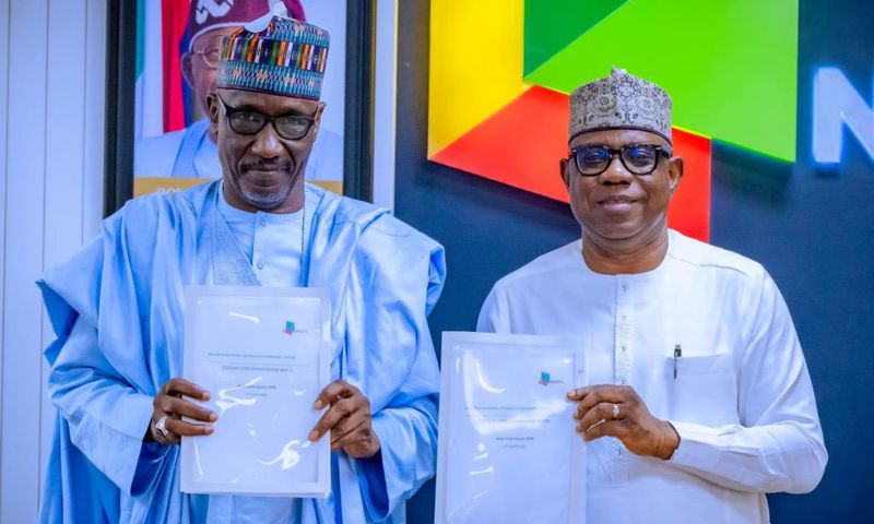 The new Group Chief Executive Officer of the Nigerian National Petroleum Company Limited (NNPC Ltd.), Bayo Ojulari (right) officially takes over from his predecessor, Mr Mele Kyari (left).