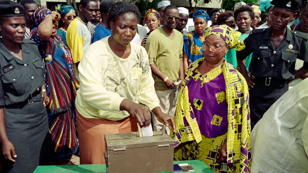 Voters put their ballot in the NEC (National Electoral Commission) box at the polling station, on June 12, 1993, during Nigeria's first presidential election after 10 years of military rule. [FRANCOIS ROJON/AFP via Getty Images]