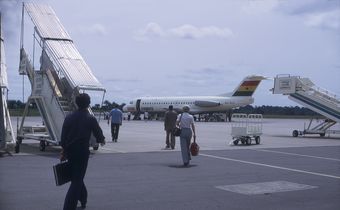 Walking on the tarmac towards a Ghana Airlines plane at the FreeTown International Aiport. May 1975 in Freetown. [Getty Images]