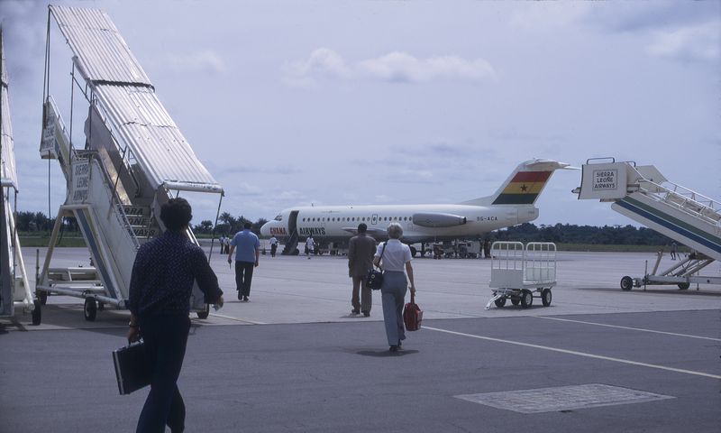 Walking on the tarmac towards a Ghana Airlines plane at the FreeTown International Aiport. May 1975 in Freetown. [Getty Images]