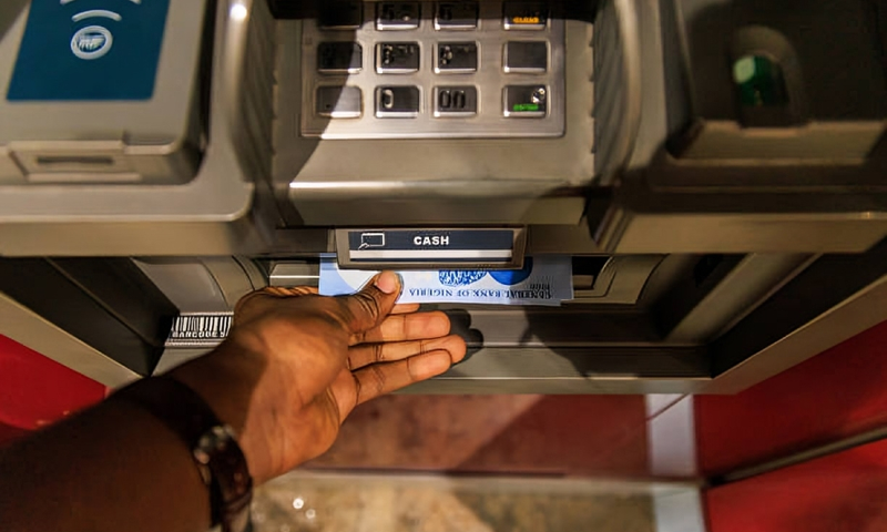 An automated teller machine (ATM) dispenses newly-designed Nigerian 1000 naira banknotes in Lagos, Nigeria, on Monday, Feb. 6, 2023. [Getty Images]