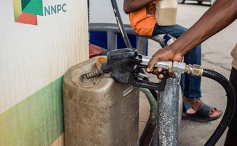 A fuel attendant fills a container with fuel for a customer at a Nigerian National Petroleum Company Ltd. (NNPC) gas station in Lagos, Nigeria, on Wednesday, Aug. 23, 2023. [Getty Images]