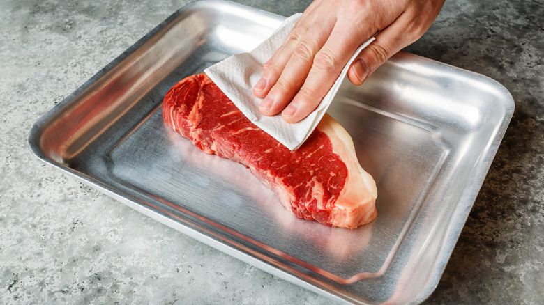 Pat your meat dry before cooking [TheDailyMeal]