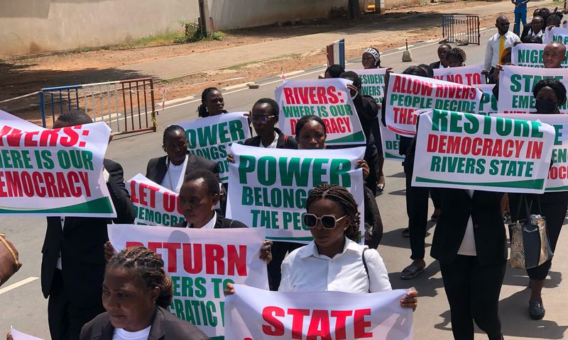 Nigerian legal professionals with placards demanding the immediate restoration of democratic governance in Rivers State. [Facebook]