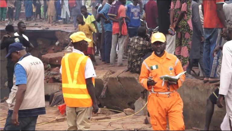 Emergency responders at the scene of the flash flood in Mokwa, Niger State [AFP]