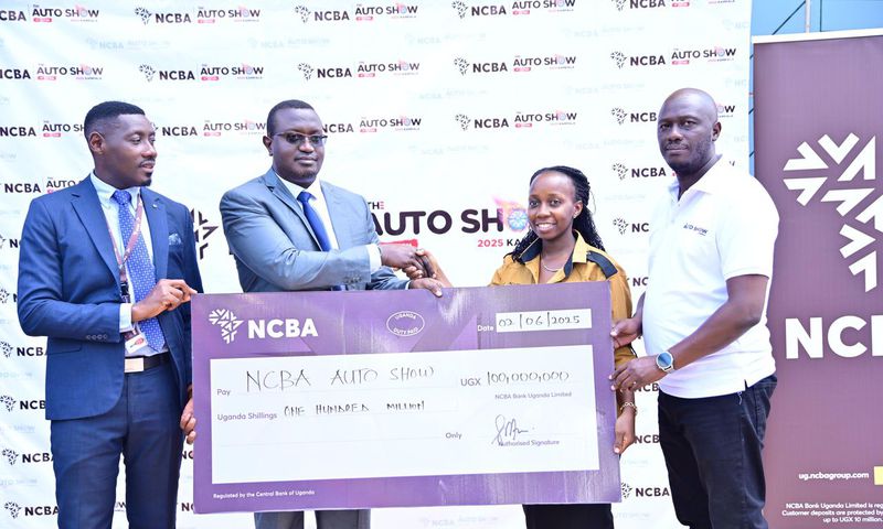 NCBA Head of Marketing, Edgar Tusiime and Head of Asset Financing, Adad Iraguha handover a cheque of ugx 100m to the Auto Show Kampala team as part of their platinum sponsorship deal