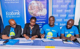 Ecobank Uganda Head of Commercial Banking, Elizabeth Mwerinde Kassedde and Moses Okiror, CEO SurePay signing the MEO at the launch of the partnership.