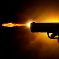 Image of a gun being fired