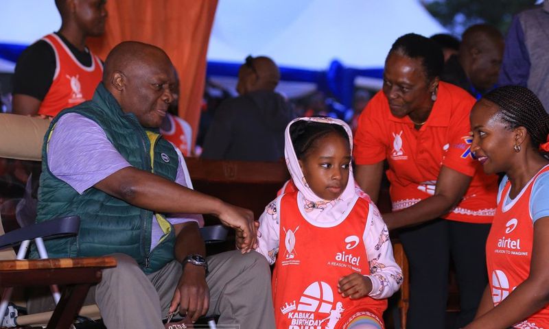 Kabaka Ronald Muwenda Mutebi greets children of Prince David Wasajja before flagging off the 12 Kabaka birthday run at Lubiri in Mengo
