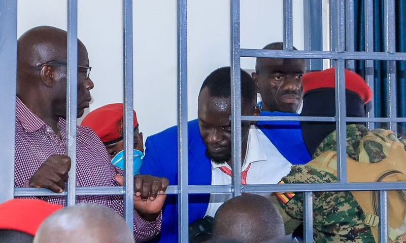 Counsel Eron Kiiza was briefly locked up in the dock with Dr Kizza Besigye and Erias Lukwago before being dragged out of the court room