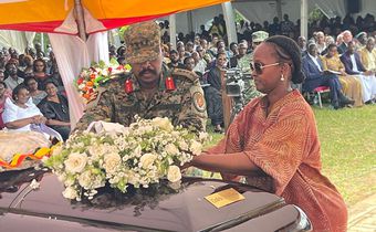 Gen Muhoozi and his wife Charlotte lay a wreath on the body of Cedric Babu