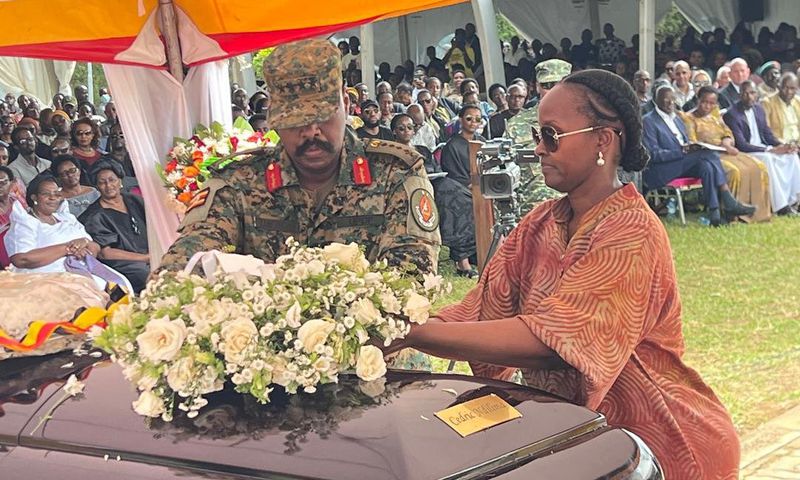 Gen Muhoozi and his wife Charlotte lay a wreath on the body of Cedric Babu