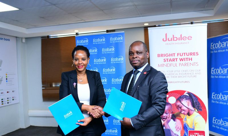 Jubilee Health Insurance CEO, Dan Musiime with Grace Muliisa, Managing Director of Ecobank Uganda
