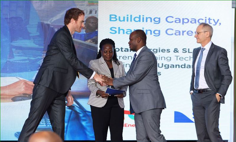 Valerian PFRIMMER, Managing Director for East and South Africa at SLB hands over the programme implementation agreement to Prof. Jude T. Lubega the Vice Chancellor of Nkumba University