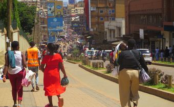 Pedestrians walk on the Kampala’s non-motorized transport corridor. Photo by Richard Hamba/ TEENS Uganda