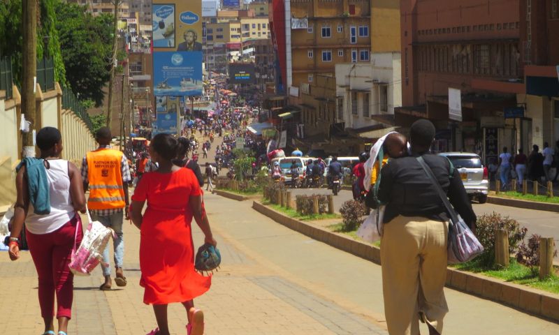 Pedestrians walk on the Kampala’s non-motorized transport corridor. Photo by Richard Hamba/ TEENS Uganda