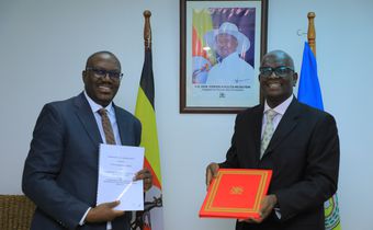 UBL Managing Director Andrew Kilonzo with Mr Bagiire Vincent Waiswa, Permanent Secretary for the Ministry of Foreign Affairs, at the deal signing