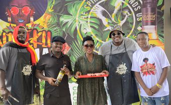(2nd Left) Uganda Waragi Brand Manager Hillary Baguma and MC Uganda (1st right) Ndeku Nyama Choma organizer at the the launcg of the 4th edition of the festival at Shisa Nyama Village