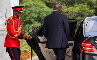 President William Ruto entering a car