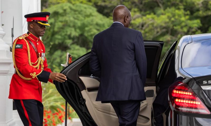 President William Ruto entering a car