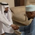 Diamond Platnumz shakes hands with a representative of the Othman family after dowry payment was accepted