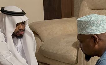 Diamond Platnumz shakes hands with a representative of the Othman family after dowry payment was accepted