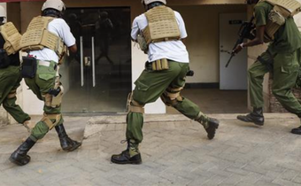 Kenyan security team advance to take on terrorists and rescue civilians in Dusit.