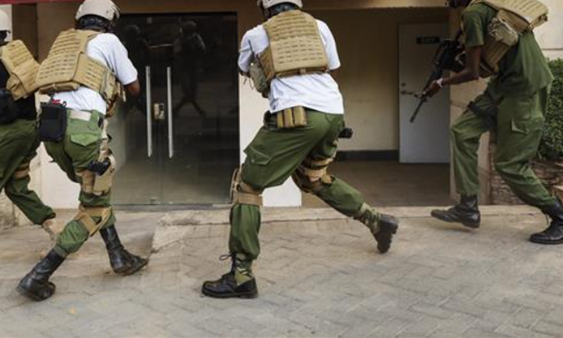 Kenyan security team advance to take on terrorists and rescue civilians in Dusit.