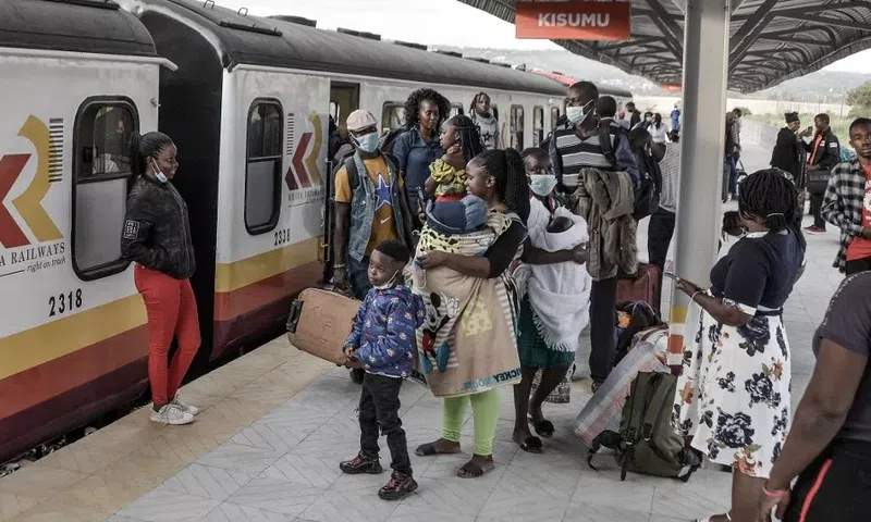 Passengers waiting to board a Kenya Railways train