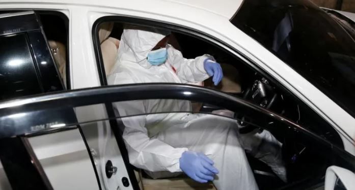 Detectives gathering evidence from the car in which the late Charles Ong'ondo Were who served as Kasipul MP was murdered.