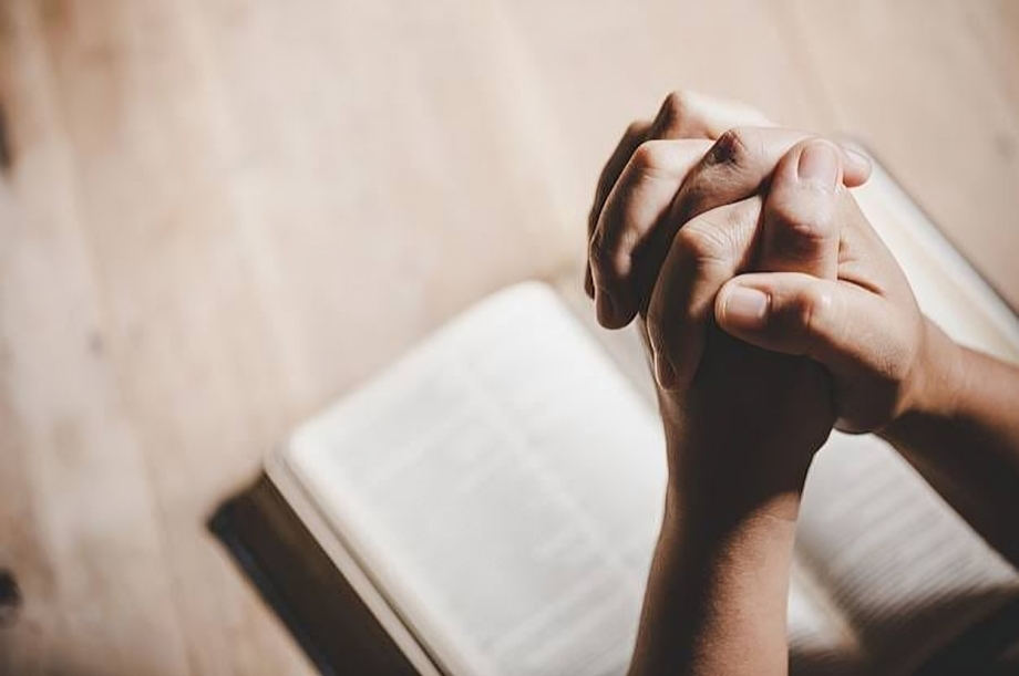 A person offering a prayer