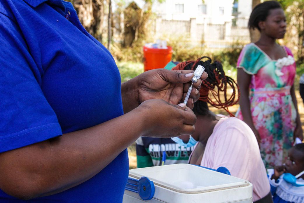 A nurse administering a vaccine