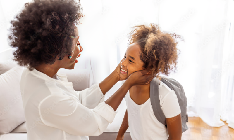 A mum preparing their child for school