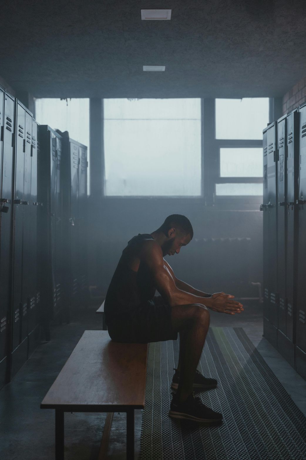 A man sitting in the locker room