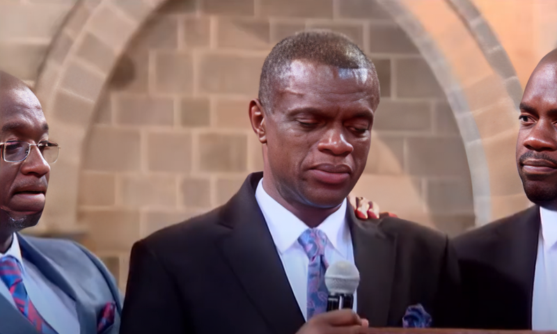 The late Edward Kwach's brother Edgar Kwach breaks down during his memorial service