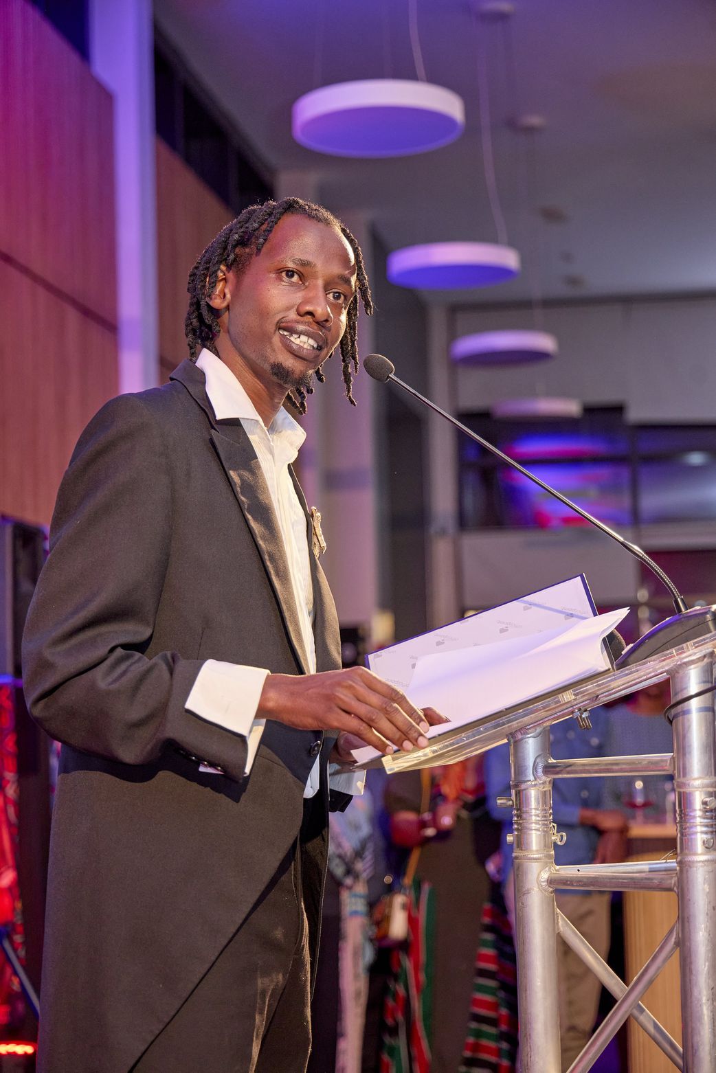Ngartia performs a spoken word piece at the launch of the UK/Kenya Season 2025