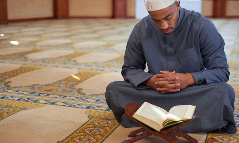 A muslim man prayin the mosque