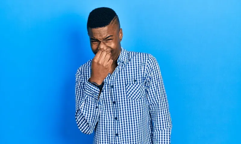 A man feeling bad breathe