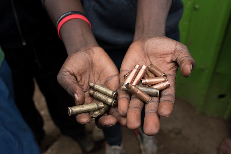 A person holding bullet cartridges