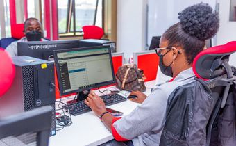 A KRA staff member working on a computer