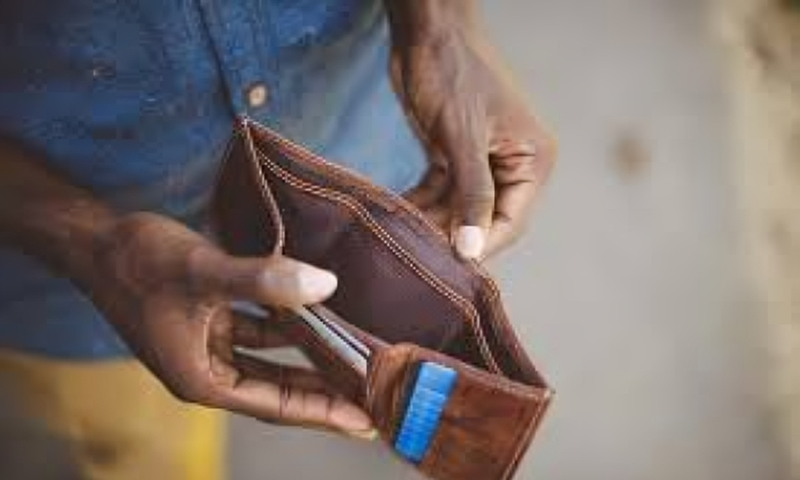 A man showing an empty wallet
