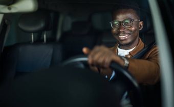 A person driving a car