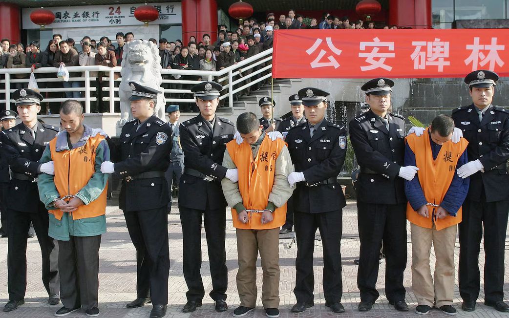 Chinese police parade a group of 15 convicted criminals to be sentenced in public