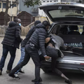 Plainclothes officers arrest a man in Nairobi, Kenya